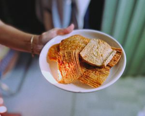 Close-up of Vietnamese spiced rice crackers served on a plate, showcasing traditional flavors.